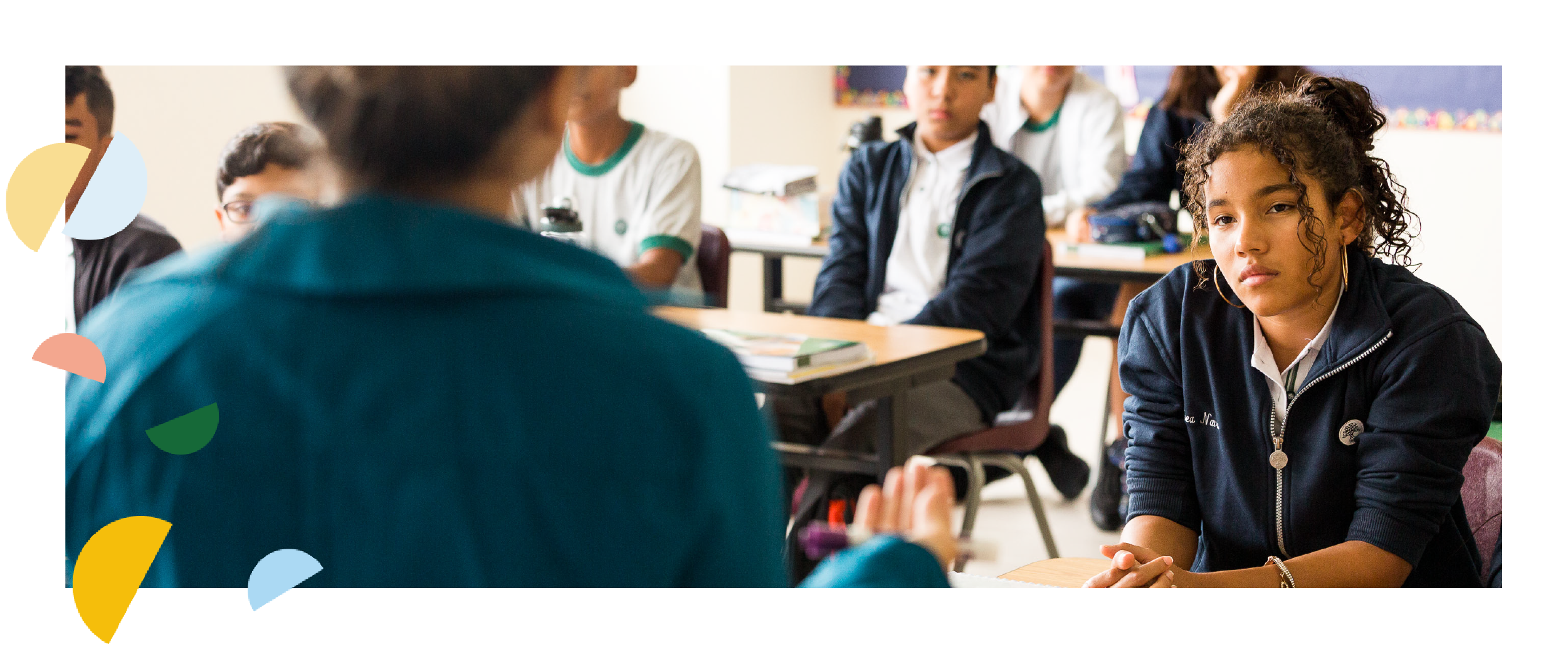 Student in class listening to her teacher