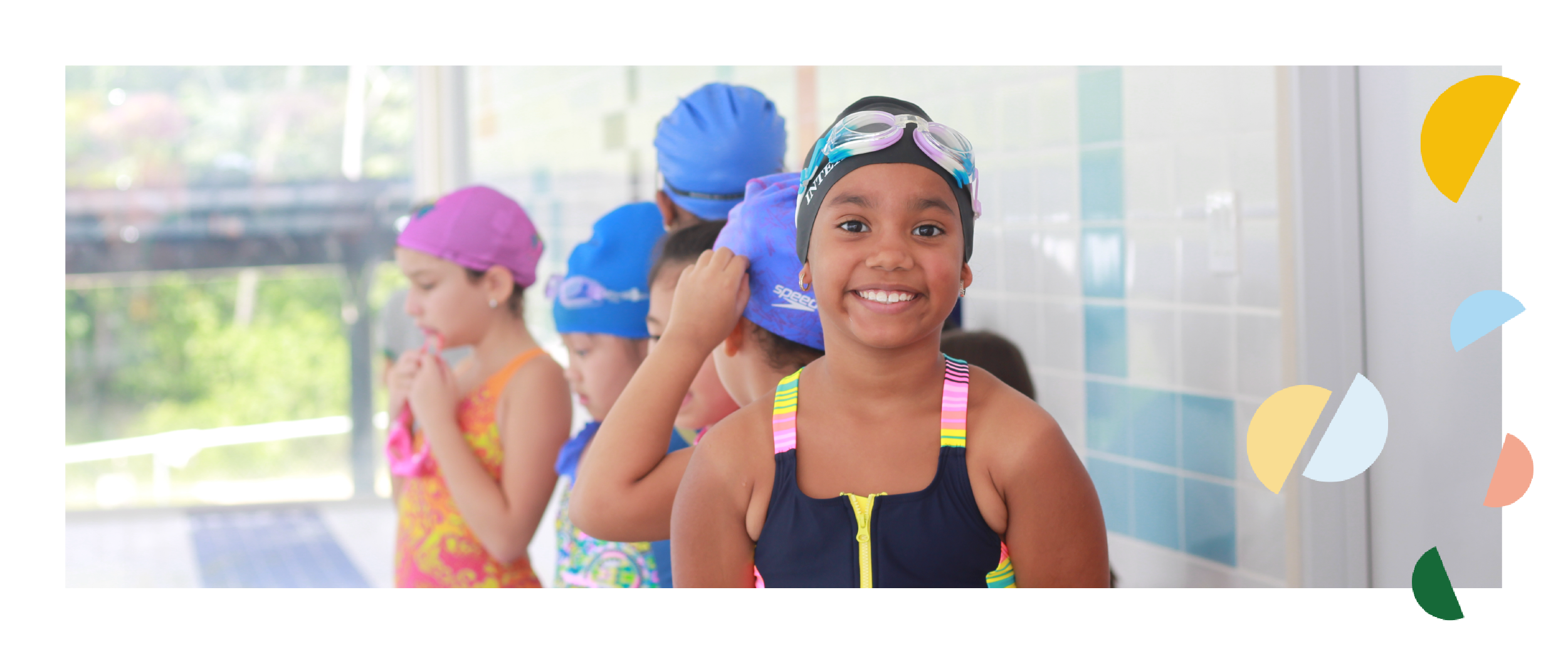 Smiling students at the swimming pool