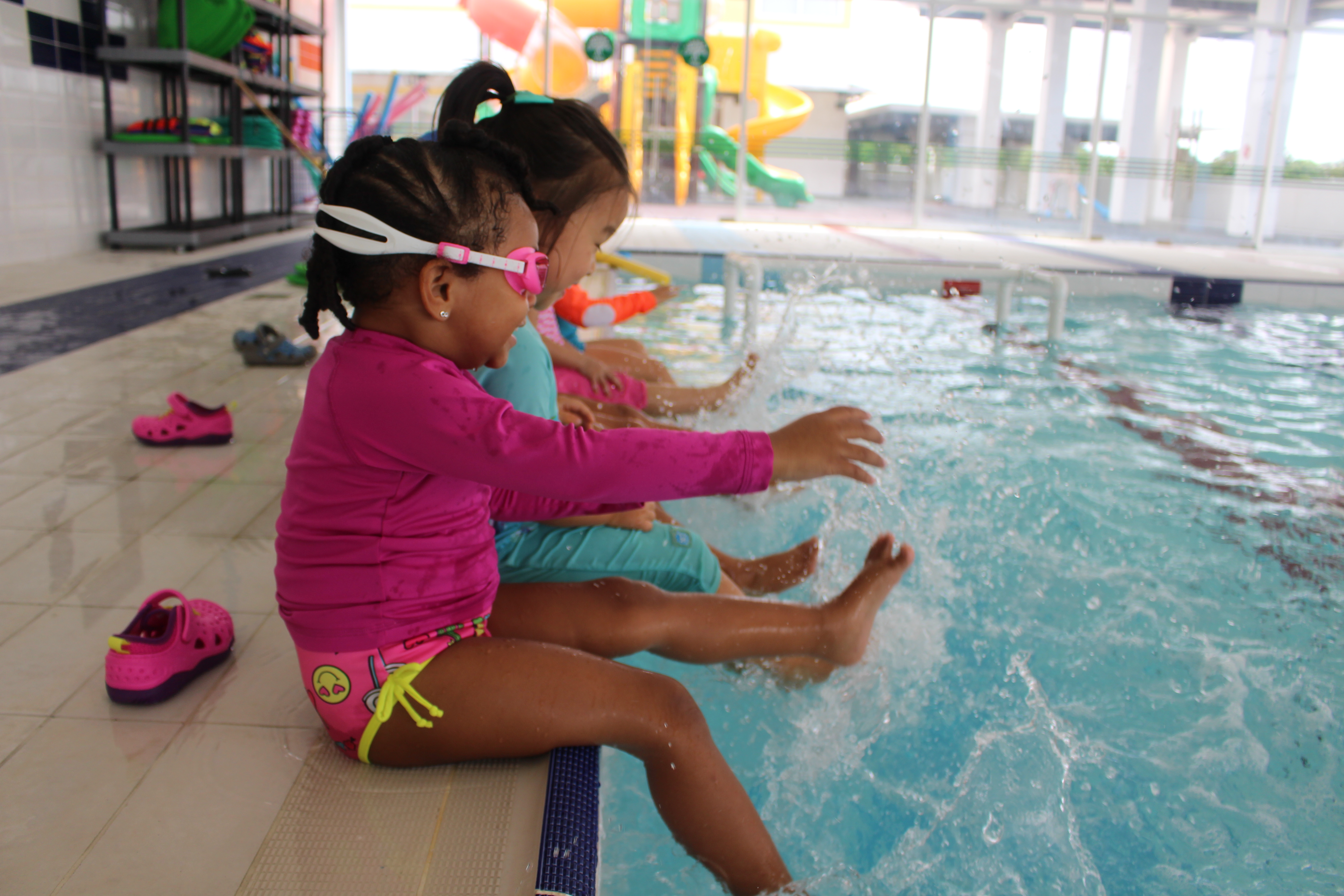 Girl students playing at the pool